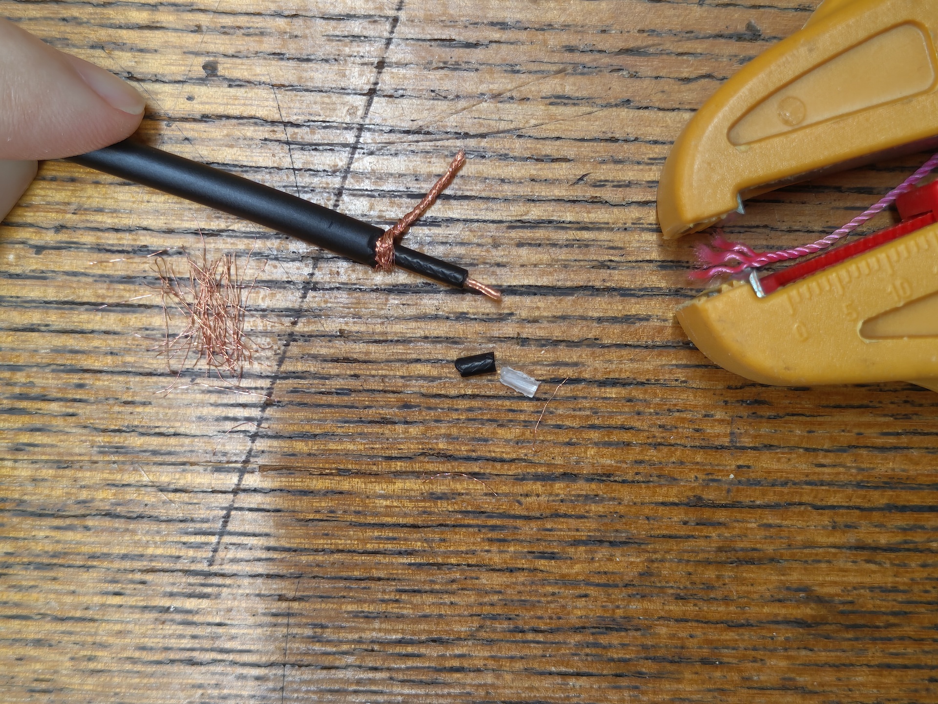 Image of cable end. The inner core wire's insulation is stripped about 5mm.